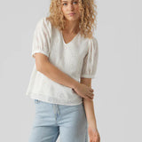 Romantic white embroidered cotton top perfect for spring outfits, vacations, and brunch dates.