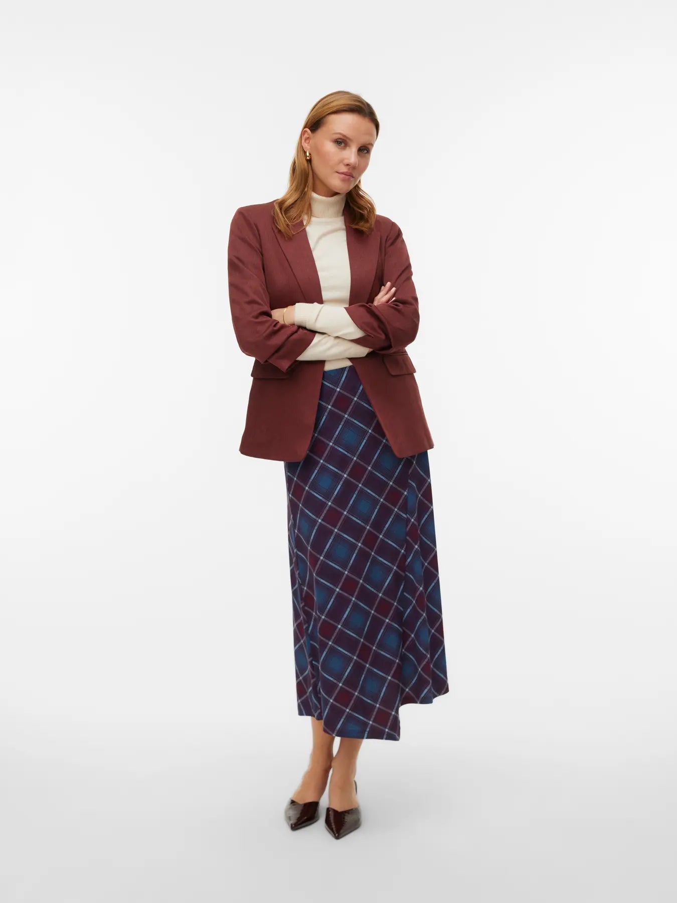 Burgundy and blue check midi skirt with diagonal plaid pattern and asymmetrical A-line silhouette for modern smart casual fashion.