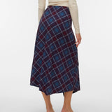 Women's multicolor plaid midi skirt featuring rich burgundy and blue tones with a flowing handkerchief hem for stylish cold-weather outfits.