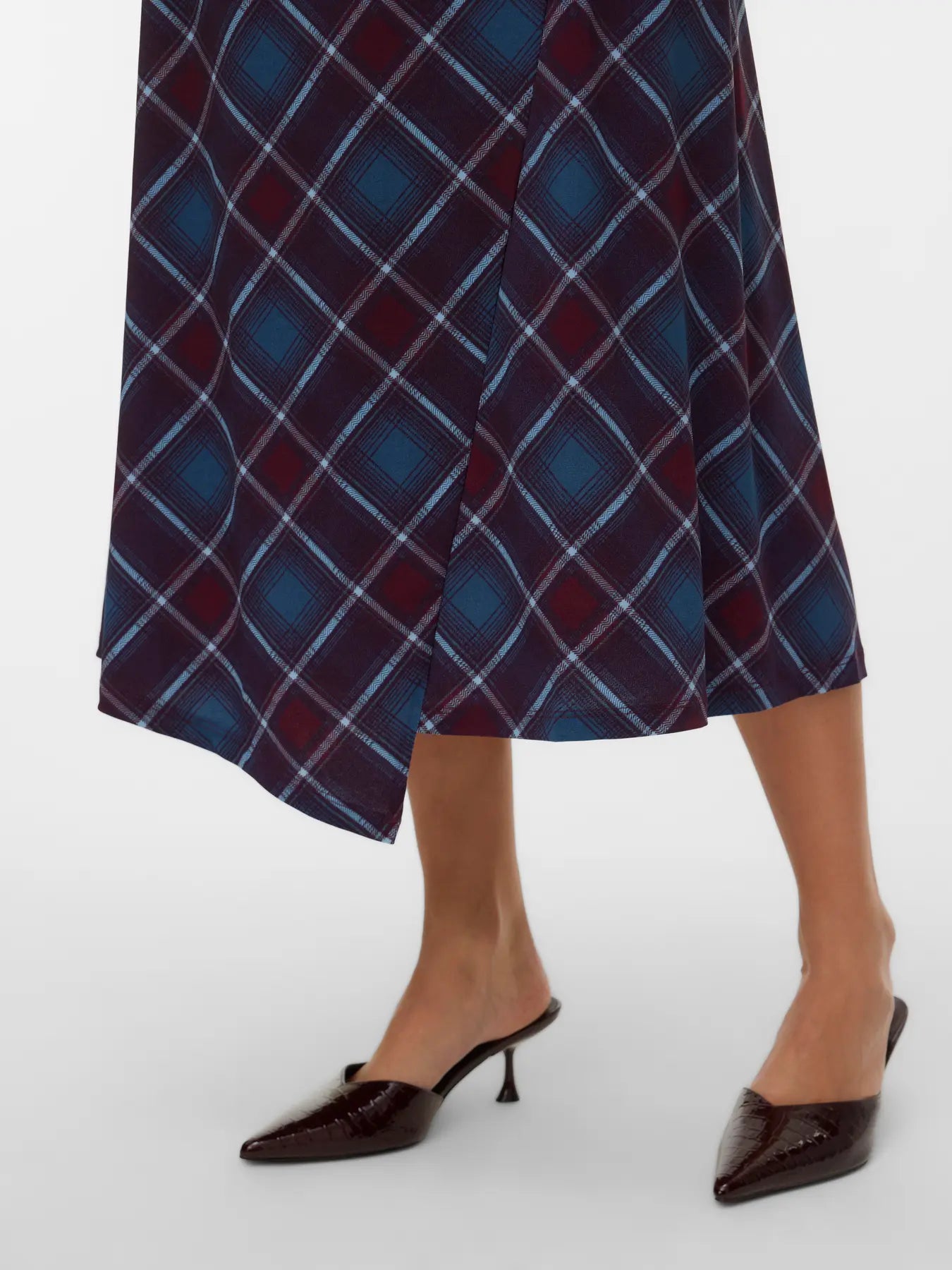 Boutique women's tartan-inspired midi skirt featuring burgundy, teal and blue checks with an asymmetric hem for sophisticated seasonal styling.