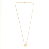 Gold seashell charm necklace with understated luxury and trendy layered necklace look.