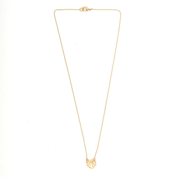 Gold seashell charm necklace with understated luxury and trendy layered necklace look.
