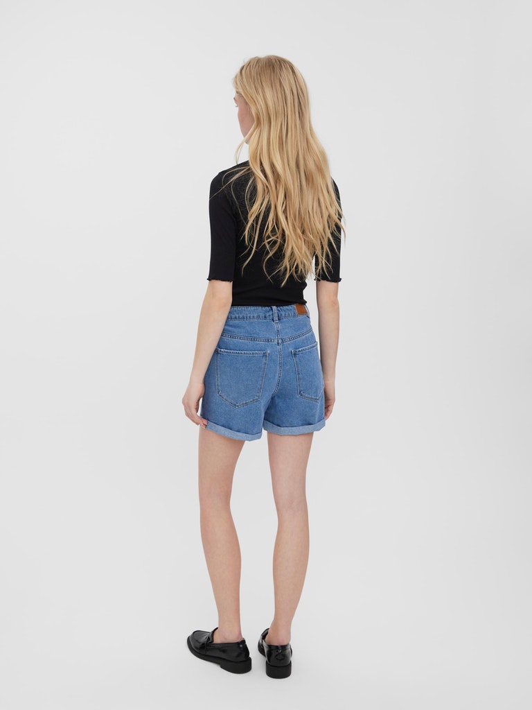 Relaxed fit cuffed denim shorts with button fly fastening and timeless casual appeal.