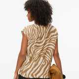 Elegant neutral zebra print sweater top featuring a lightweight knit, cap sleeves and modern boat neck for effortless boutique fashion.