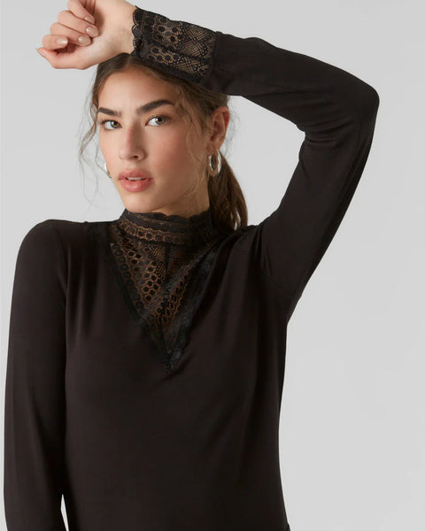 Women’s black lace high neck blouse with long sleeves and sophisticated feminine silhouette for modern style.