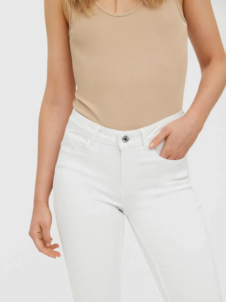 Everyday white skinny jeans for women with stretch fabric and flattering streamlined silhouette.