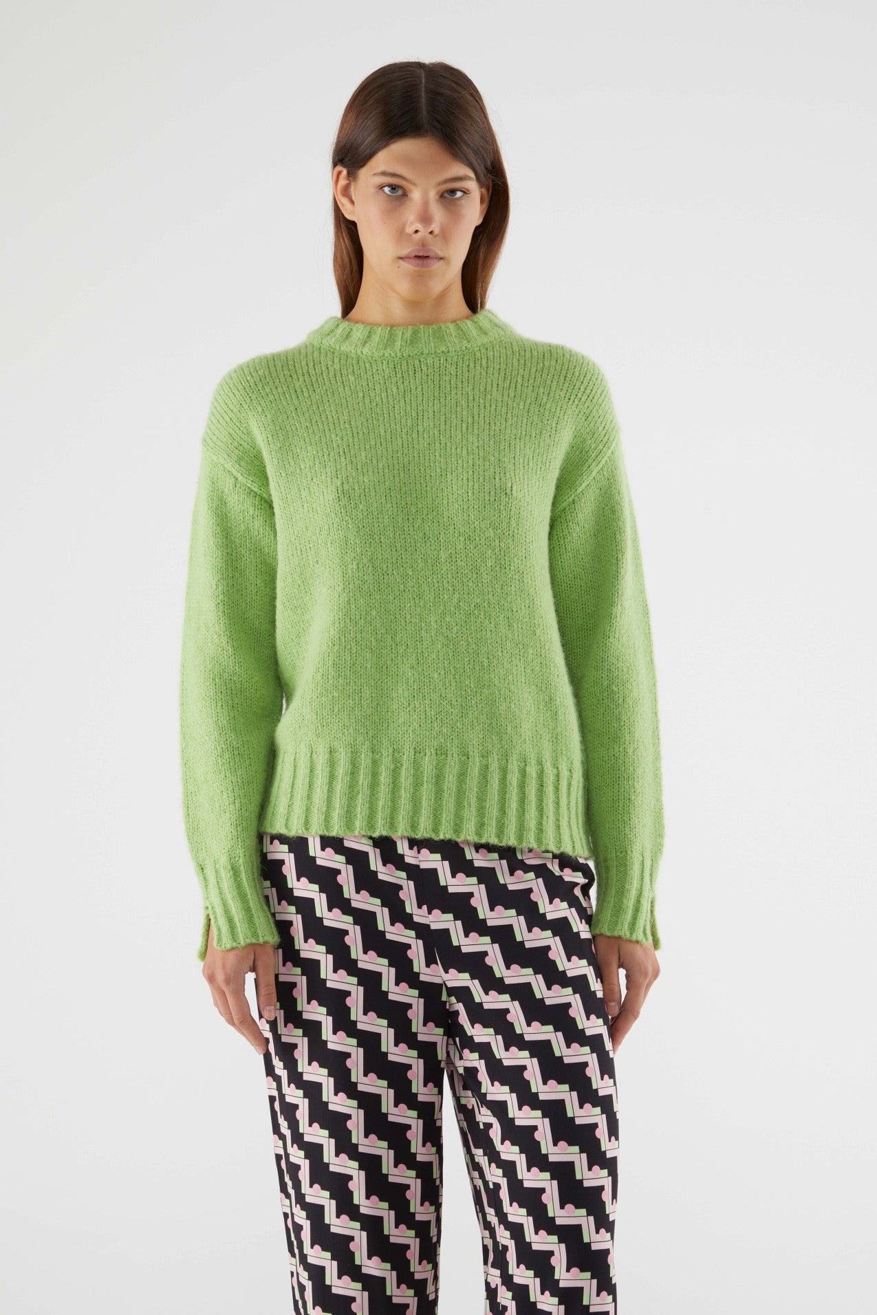Cozy oversized crewneck sweater in light green with fluffy knit fabric and modern relaxed fit for everyday fashion.