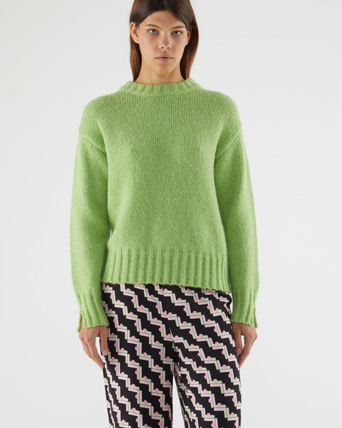 Cozy oversized crewneck sweater in light green with fluffy knit fabric and modern relaxed fit for everyday fashion.
