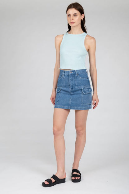 Light blue sleeveless top ideal for spring fashion, travel outfits, and weekend wear.
