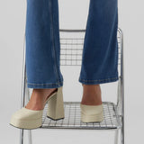 Women’s blue denim flare trousers with modern cropped length and classic everyday fashion versatility.