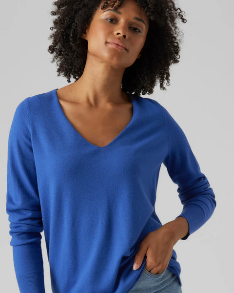 Women’s bright blue lightweight pullover with classic V-neck and modern minimalist wardrobe style.