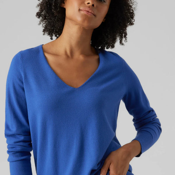 Women’s bright blue lightweight pullover with classic V-neck and modern minimalist wardrobe style.