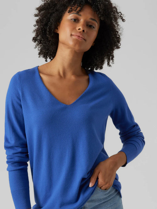 Women’s bright blue lightweight pullover with classic V-neck and modern minimalist wardrobe style.