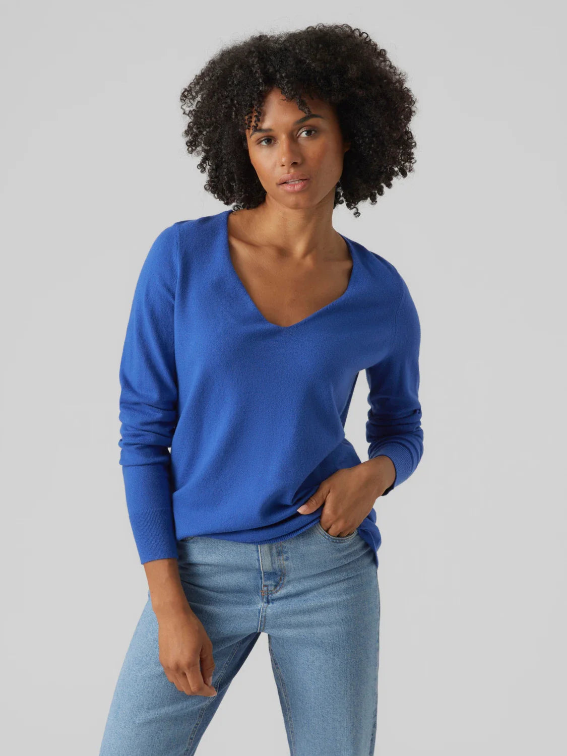 Women’s soft blue V-neck jumper with relaxed silhouette and timeless modern knitwear appeal.