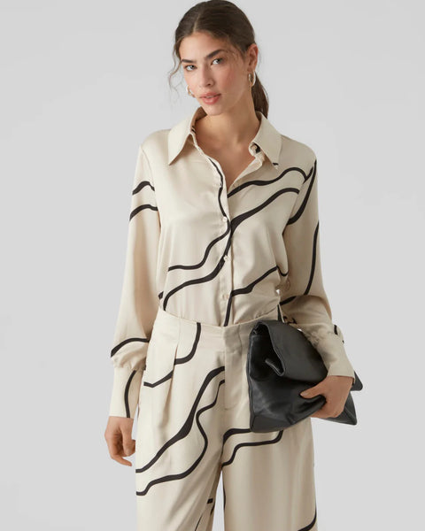 Contemporary abstract print blouse in cream and black with classic collar and relaxed fit for timeless sophisticated style.