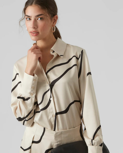 Minimalist women’s patterned blouse featuring artistic black wave detailing and elegant button-front design for modern fashion lovers.