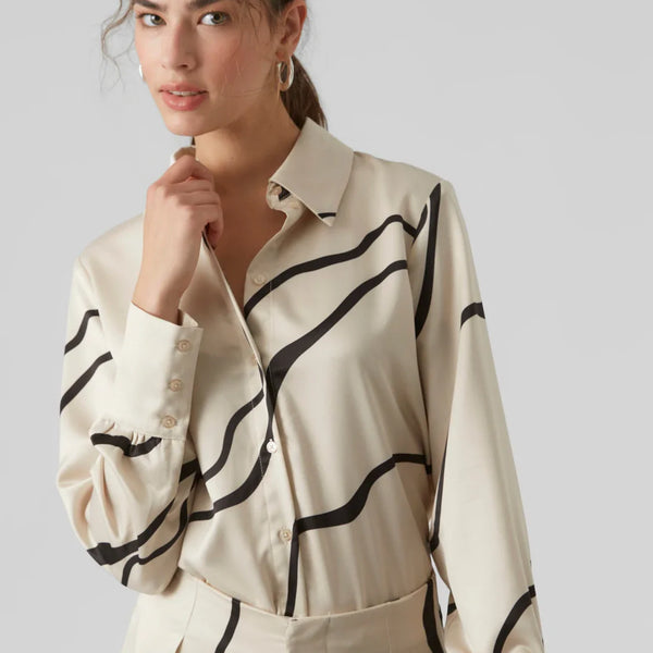 Minimalist women’s patterned blouse featuring artistic black wave detailing and elegant button-front design for modern fashion lovers.
