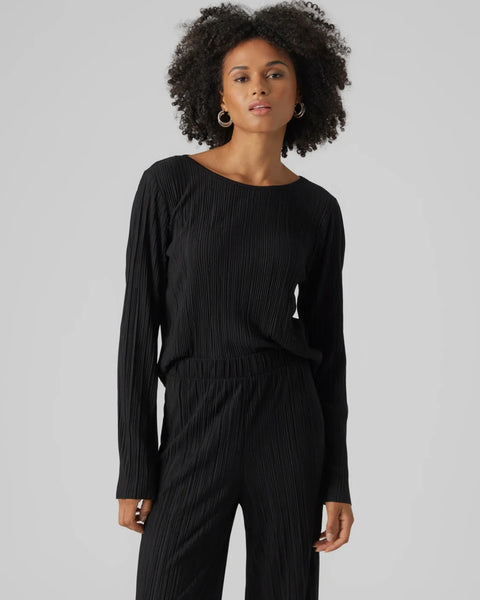 Women’s minimalist black textured blouse with elegant pleats and modern effortless chic styling.