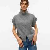 Women’s gray high-neck sweater vest with zip front and short cap sleeves for contemporary fall and winter fashion.