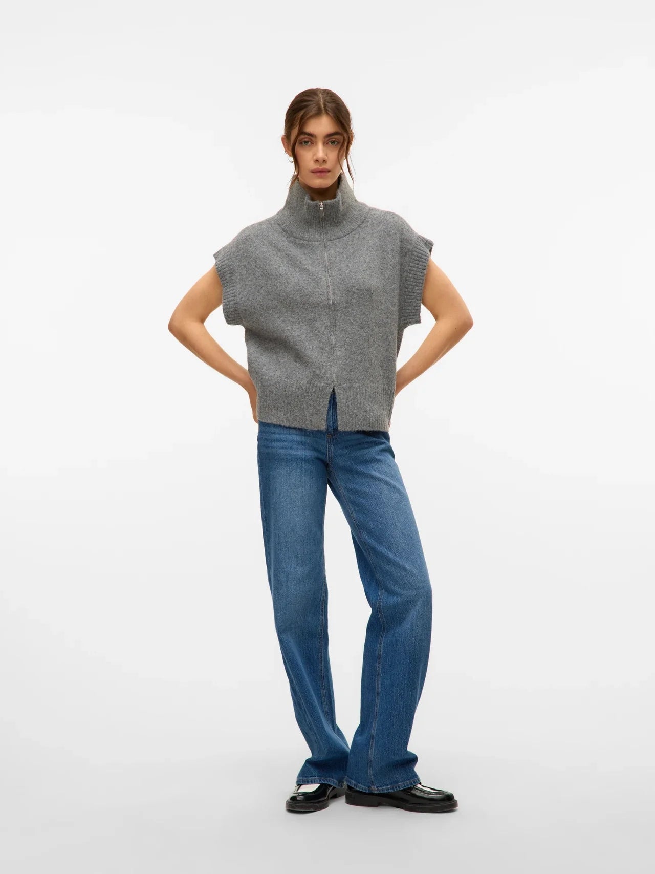 Women’s gray zip-up sweater vest with high neck, cap sleeves, and relaxed fit for trendy layered fall outfits.