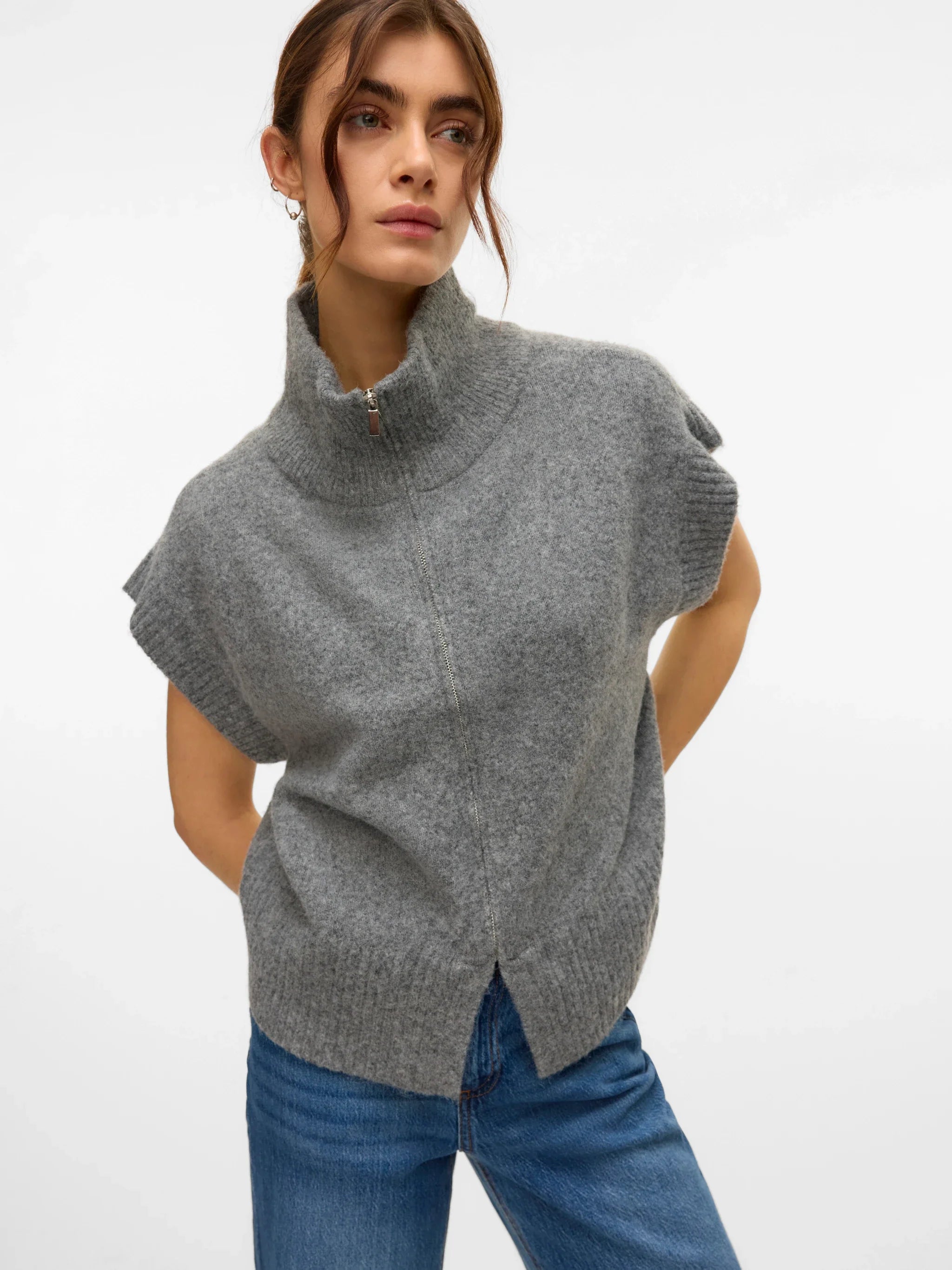 Women’s gray knit sweater vest featuring a full zip front and high collar for modern transitional layering.