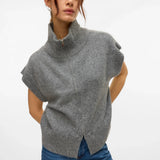 Women’s gray knit sweater vest featuring a full zip front and high collar for modern transitional layering.