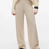 Cream wide-leg trousers for women with a high-rise waist and fluid relaxed fit for smart casual outfits.