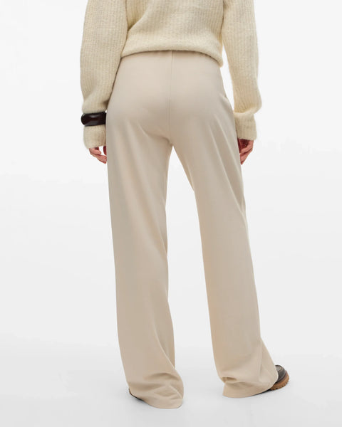 Boutique women's cream wide-leg trousers with a sophisticated high-rise design for minimalist and contemporary wardrobes.