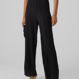 Black flowy wide leg pants for women with pleated fabric and elevated casual chic styling.