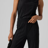 Women’s modern black flowy pants with elastic waist and sophisticated pleated fabric finish.