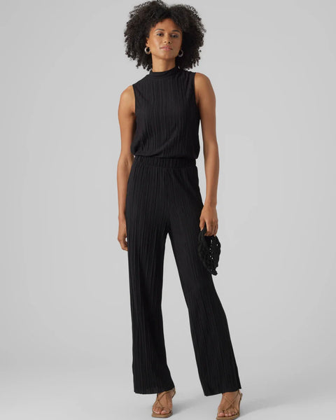 Women’s dressy black wide leg pants featuring soft pleated texture and effortless evening-ready style.