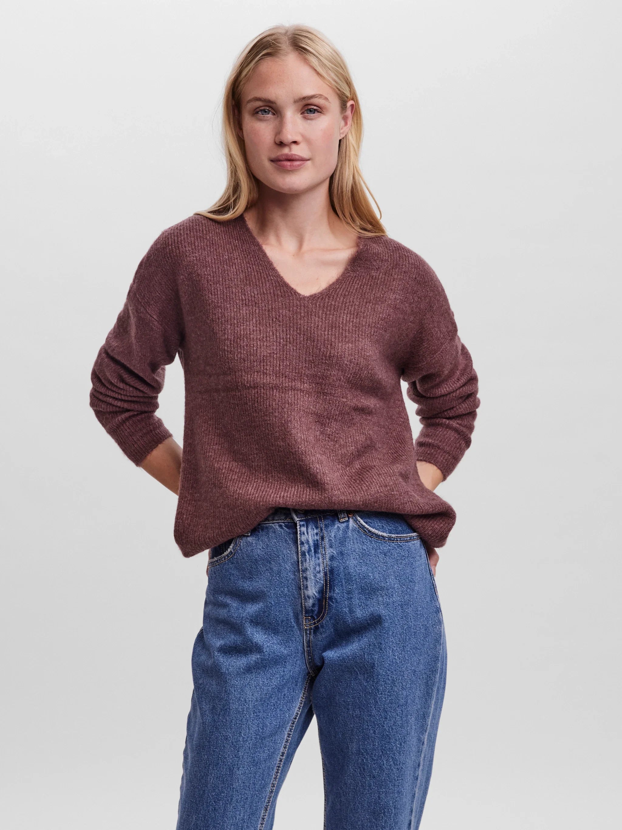 Women’s soft heather wine knit sweater with long sleeves and flattering V-neck for versatile everyday wear.