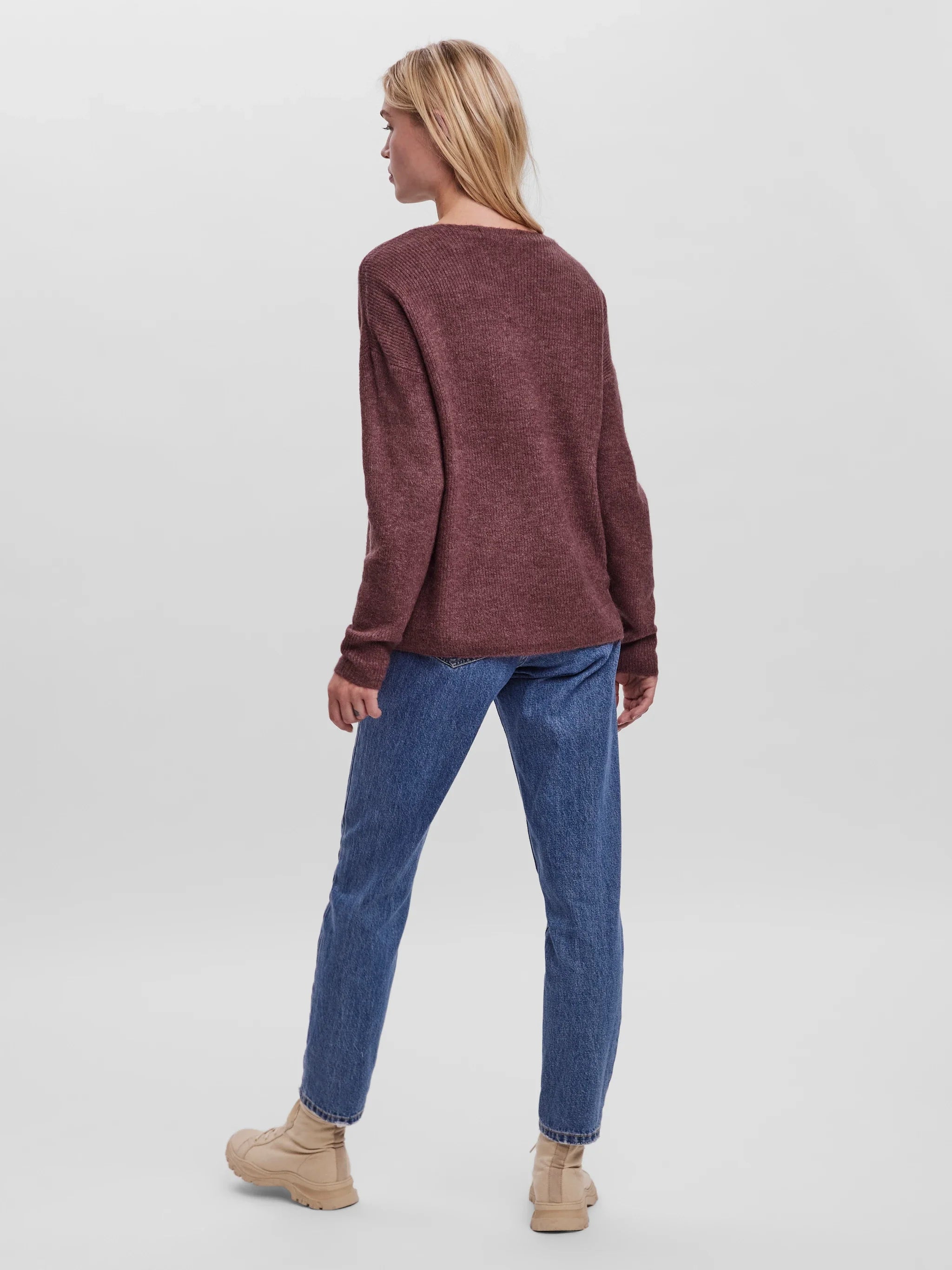 Women’s burgundy V-neck sweater with relaxed fit, long sleeves, and soft knit texture for casual fall and winter outfits.