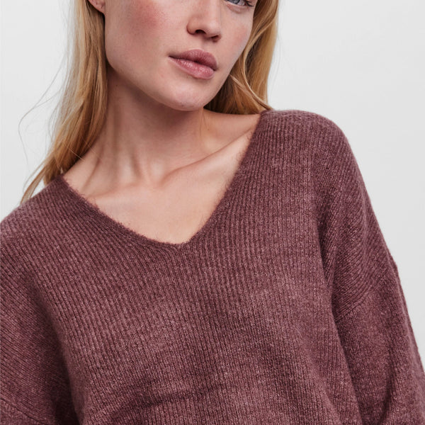 Women’s wine red V-neck knit sweater featuring a relaxed silhouette and lightweight knit for effortless everyday style.
