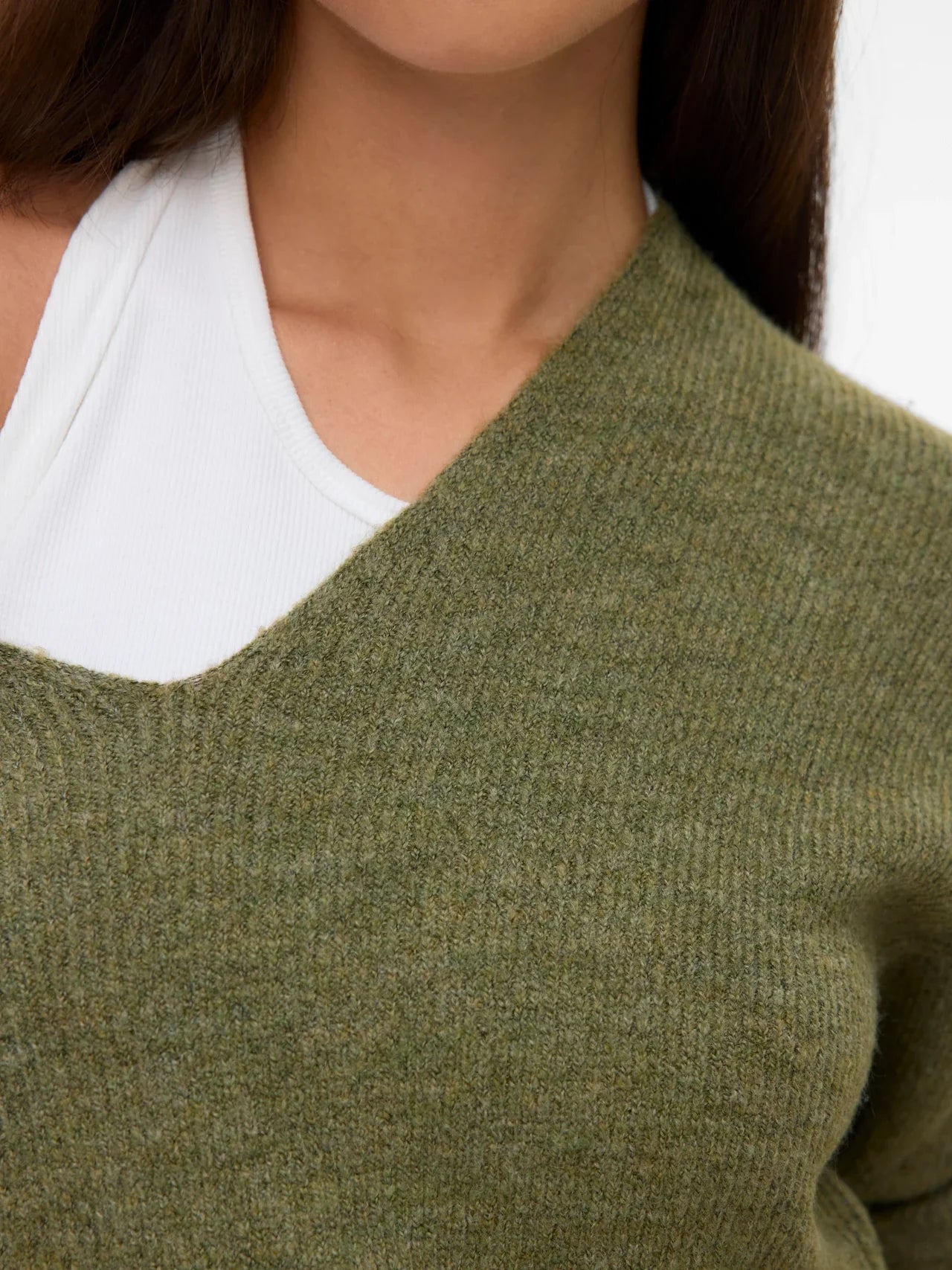 Women’s olive green knit sweater with V-neckline for chic casual outfits with jeans and trousers.