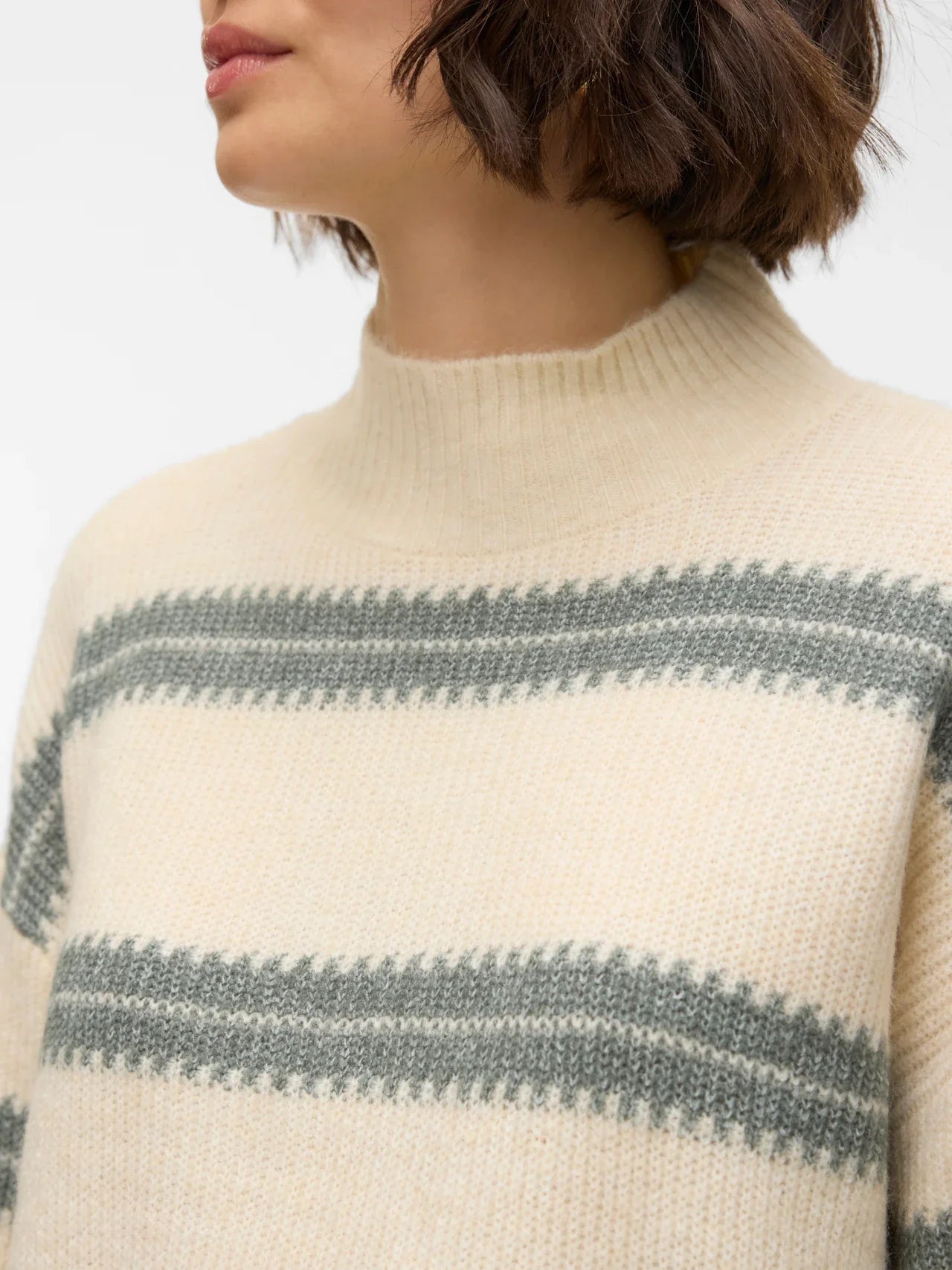 Women’s cozy mock neck pullover with subtle stripe pattern and elevated everyday fashion versatility.