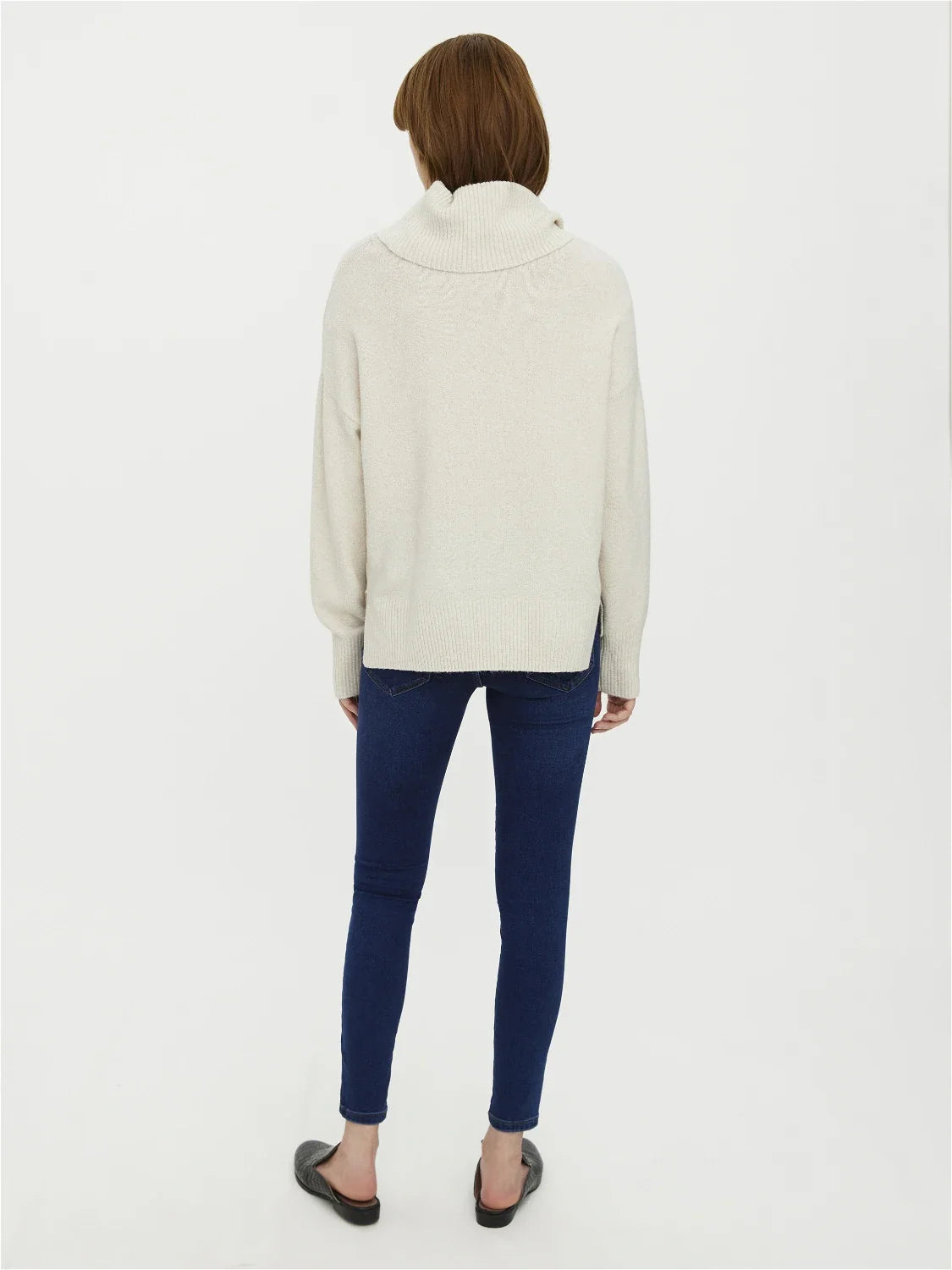 Stylish ivory oversized knit sweater with  cowl neck and ribbed hem detailing and elevated minimalist wardrobe appeal.