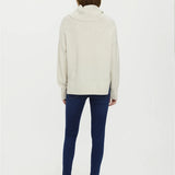 Stylish ivory oversized knit sweater with  cowl neck and ribbed hem detailing and elevated minimalist wardrobe appeal.