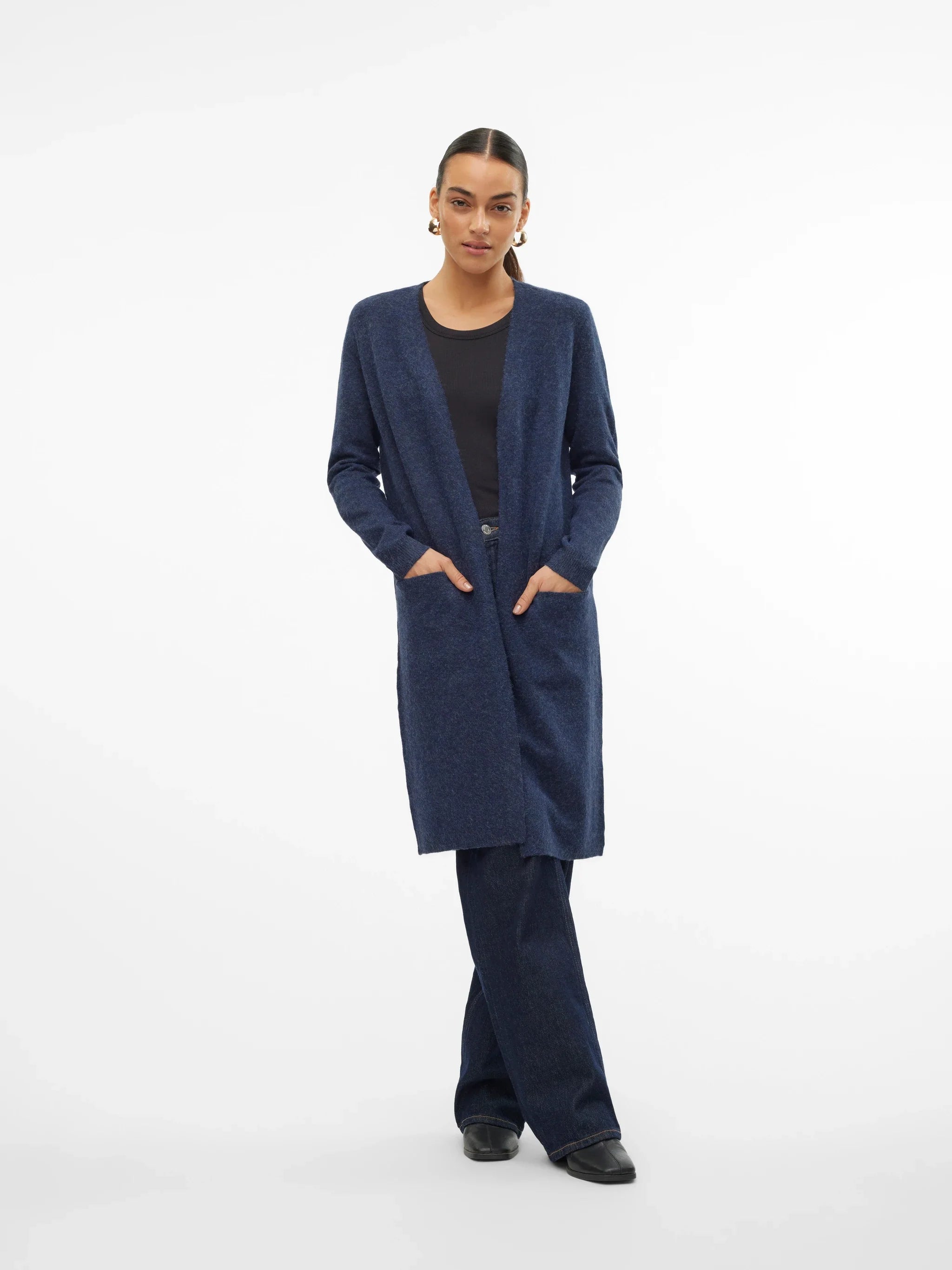 Trendy navy blue cardigan sweater with relaxed fit, front pockets, and cozy contemporary fashion aesthetic.