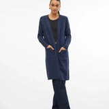 Trendy navy blue cardigan sweater with relaxed fit, front pockets, and cozy contemporary fashion aesthetic.