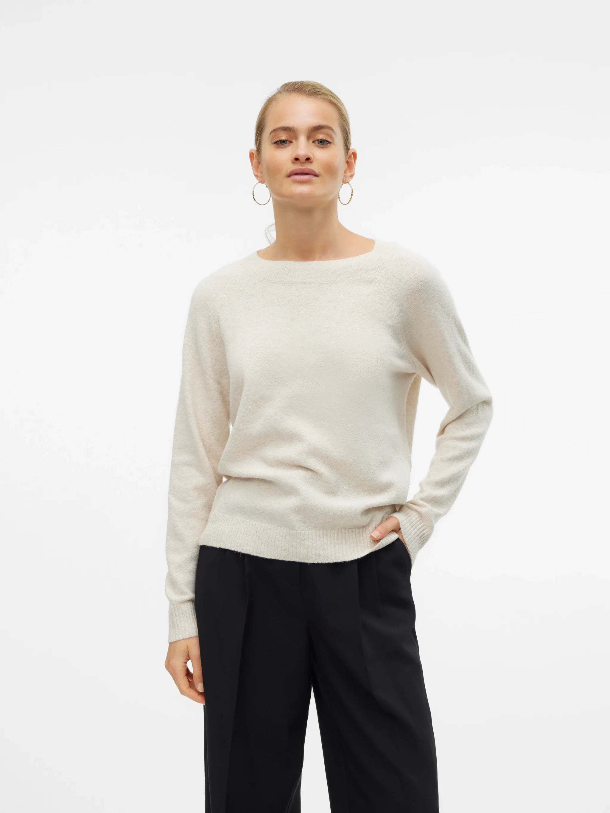 Women’s ivory crew-neck sweater with long sleeves and relaxed fit for minimalist outfits, casual workwear, and everyday fall fashion.