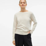 Women’s ivory crew-neck sweater with long sleeves and relaxed fit for minimalist outfits, casual workwear, and everyday fall fashion.