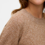 Close up of everyday luxury knitwear with warm earthy tones and elevated off-duty aesthetic