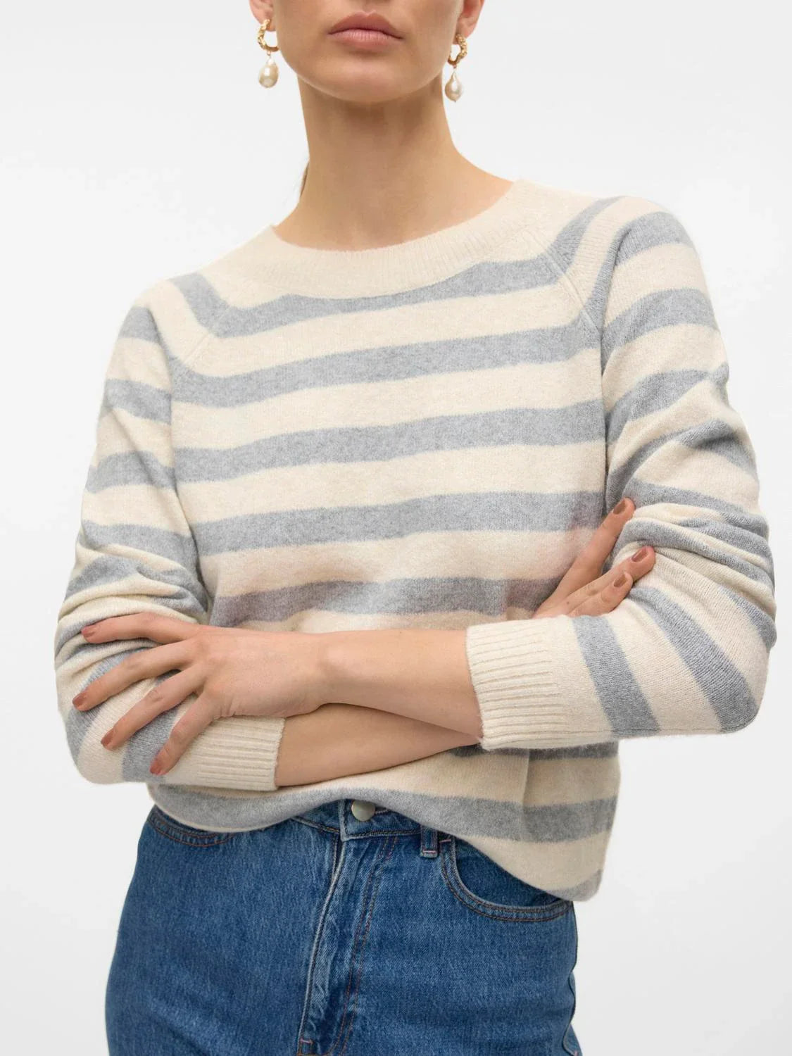 Cozy women’s striped knit sweater with ribbed cuffs and soft fabric for fall and winter layering outfits.