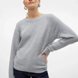 Women’s soft-touch gray sweater featuring classic round neckline and comfortable relaxed knit silhouette.
