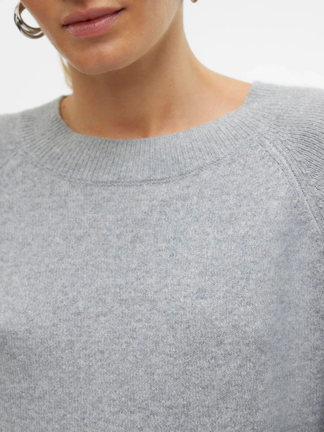 Lightweight gray sweater for women with soft knit material and timeless Scandinavian-inspired fashion look.
