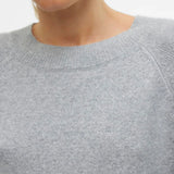 Lightweight gray sweater for women with soft knit material and timeless Scandinavian-inspired fashion look.
