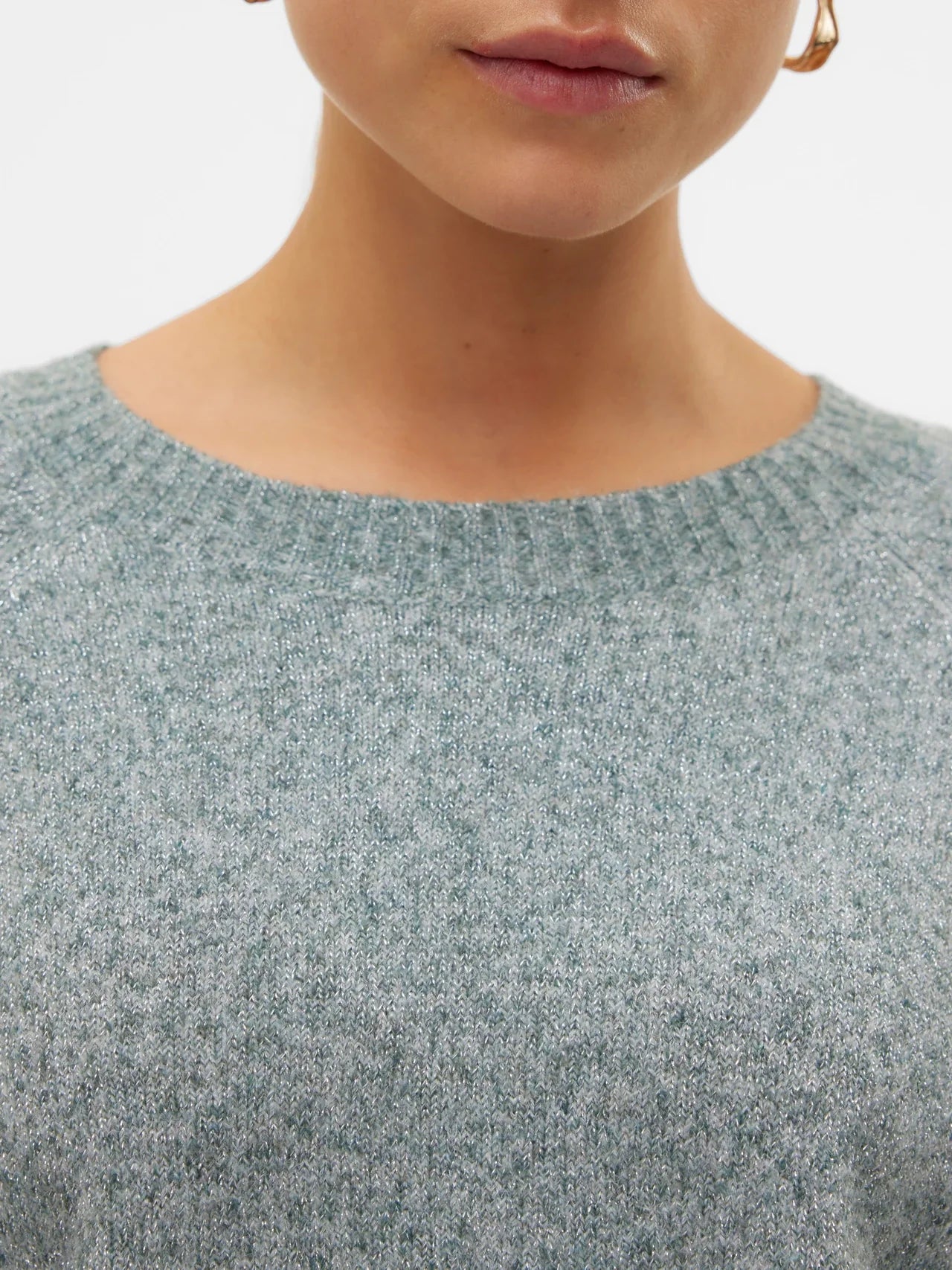 Boutique women's balsam green knit sweater with long sleeves and ribbed cuffs for a versatile capsule wardrobe.