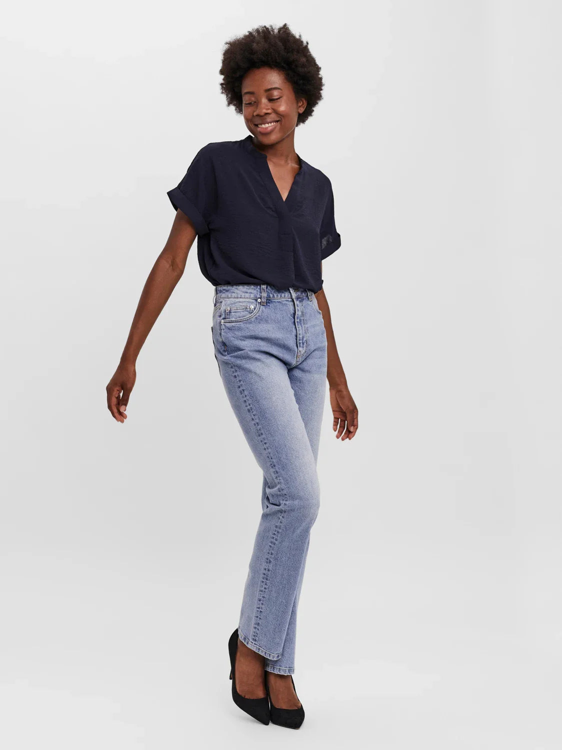 High-rise straight fit jeans in vintage light wash denim for versatile casual looks and elevated street style outfits.