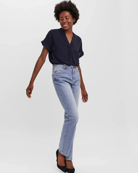 High-rise straight fit jeans in vintage light wash denim for versatile casual looks and elevated street style outfits.